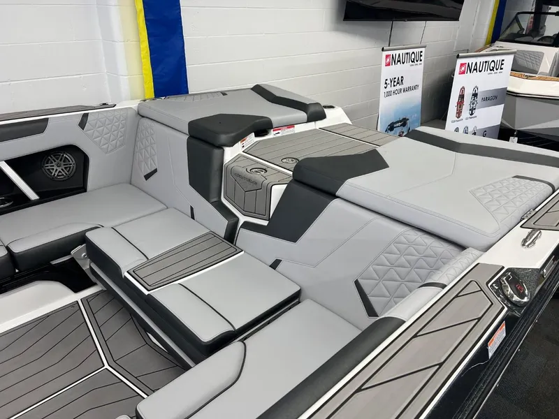 Slide: The Image of 2024 Nautique Super Air Nautique GS24 interior with sleek, modern seating and design. - 5