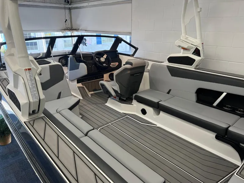 Slide: The Image of 2024 Nautique Super Air Nautique GS24 interior with sleek seating and modern dashboard design. - 6