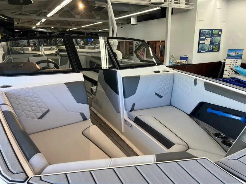 Slide: The Image of 2024 Nautique Super Air Nautique GS24 interior with modern seating and sleek design. - 9
