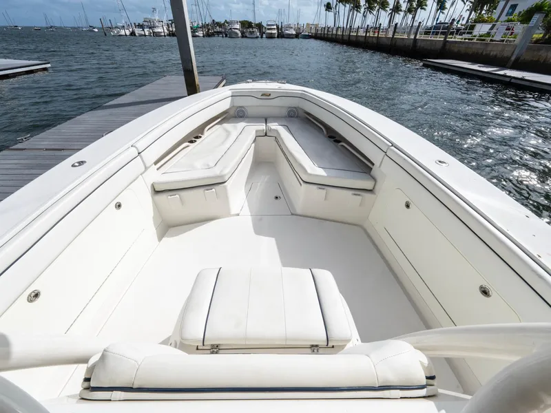 Slide: The Image of 2017 Jupiter 34 HFS boat with spacious seating at a marina dock. - 14