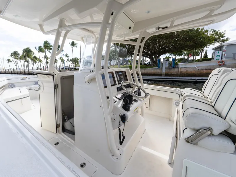 Slide: The Image of 2017 Jupiter 34 HFS boat interior with helm, seating, and modern controls. - 16
