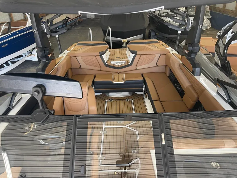 Slide: The Image of 2024 Nautique Super Air Nautique G23 interior with tan seating and sleek design. - 3