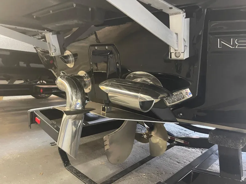 Slide: The Image of Close-up of 2024 Nautique Super Air Nautique G23 boat propeller and exhaust system. - 32