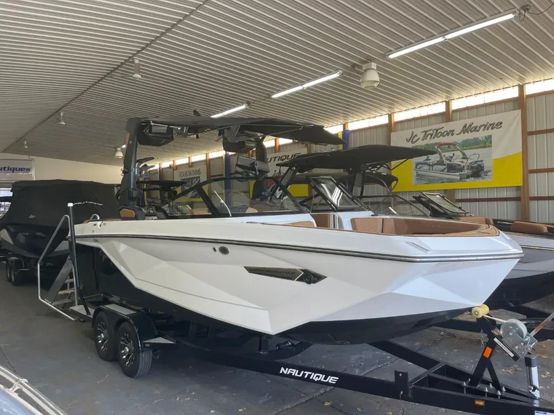 Slide: The Image of 2024 Nautique Super Air Nautique G23 boat in showroom, on trailer. - 34