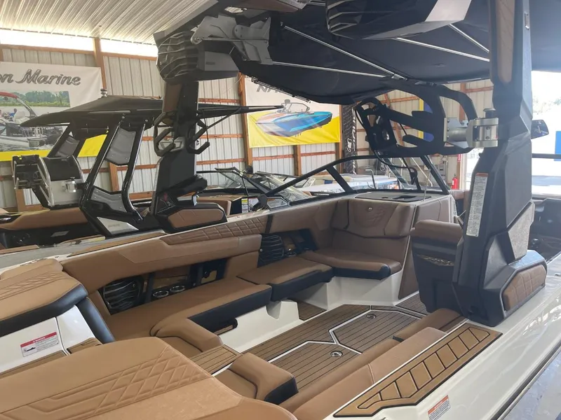Slide: The Image of 2024 Nautique Super Air Nautique G23 interior with luxurious seating and modern design. - 35