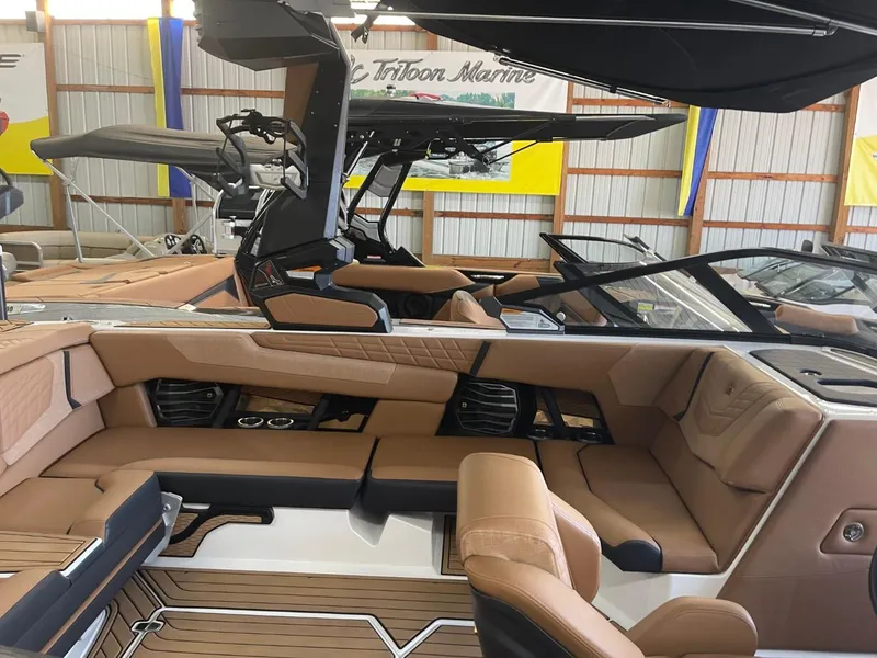 Slide: The Image of 2024 Nautique Super Air Nautique G23 interior with luxurious tan seating and sleek design. - 36