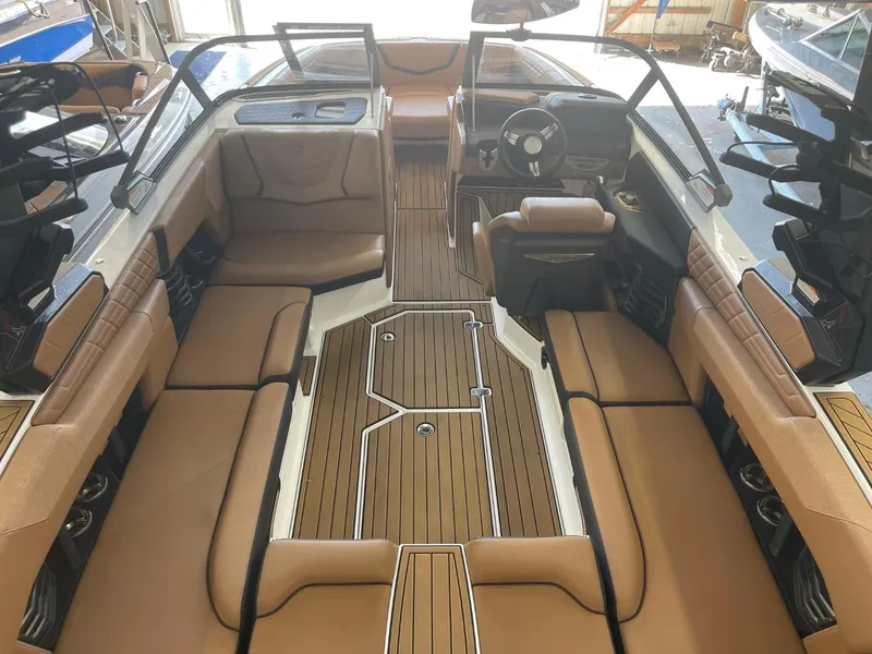 Slide: The Image of 2024 Nautique Super Air Nautique G23 interior with luxurious seating and sleek design. - 7