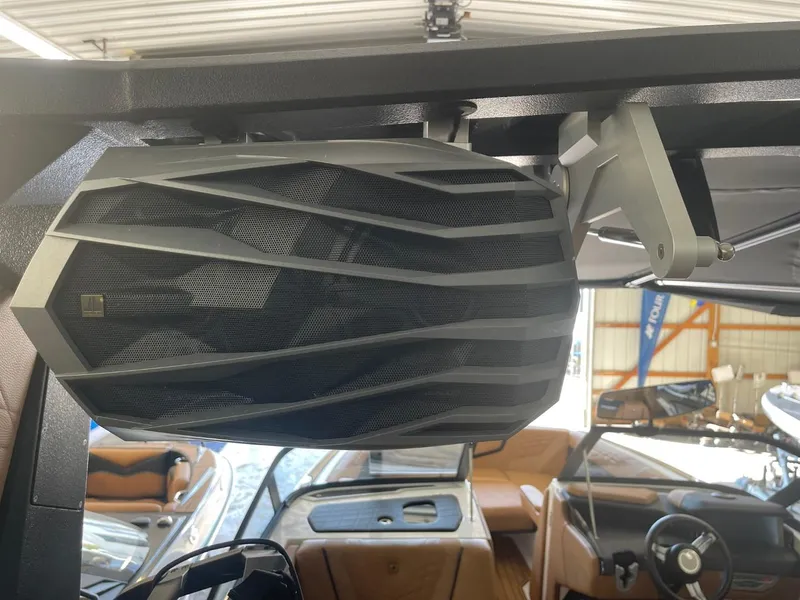 Slide: The Image of 2024 Nautique Super Air Nautique G23 boat speaker system in cabin. - 9