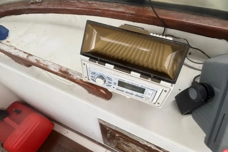 Slide: The Image of 1983 Albin Double Cabin boat interior with vintage radio and speaker system. - 12