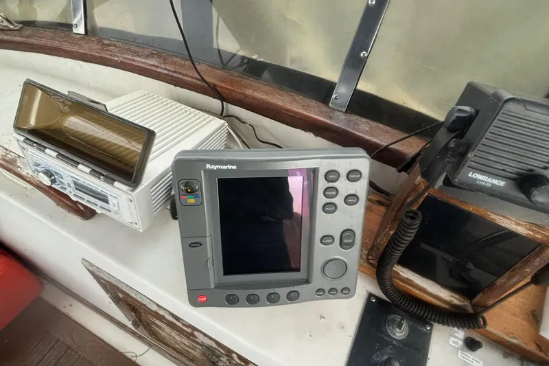 Slide: The Image of Navigation equipment on 1983 Albin Double Cabin boat dashboard. - 13