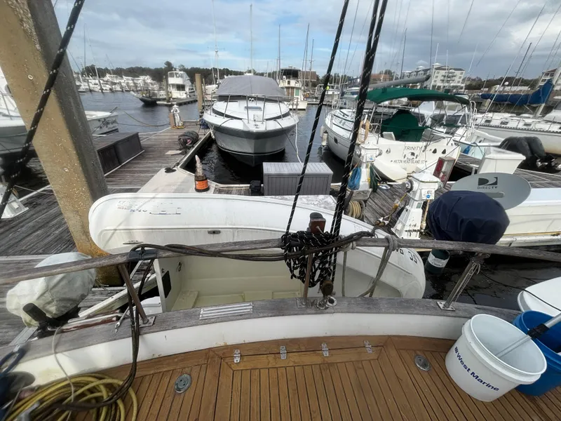 Slide: The Image of 1983 Albin Double Cabin boat docked at marina with other vessels. - 19