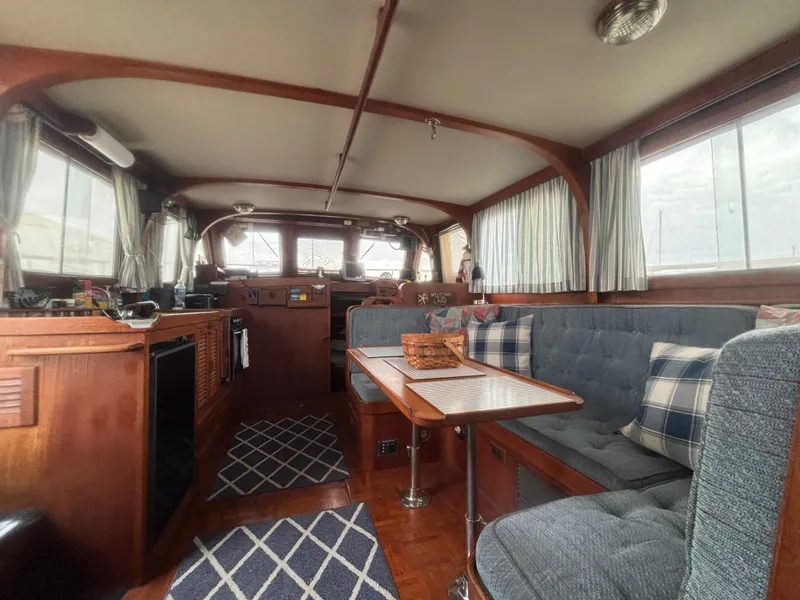 Slide: The Image of Interior of 1983 Albin Double Cabin boat with cozy seating and wooden finishes. - 27