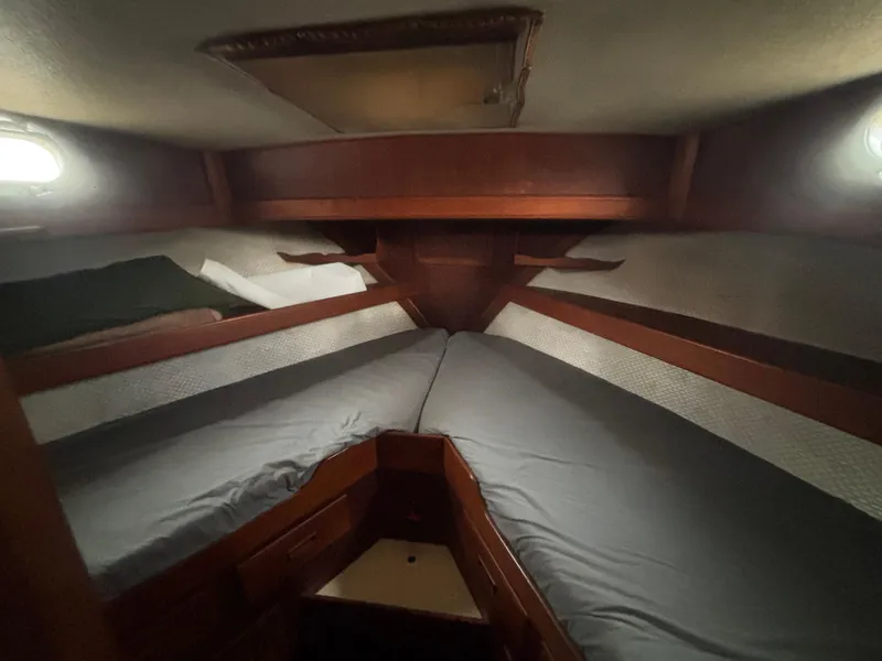Slide: The Image of 1983 Albin Double Cabin interior with cozy V-berth and wooden accents. - 38