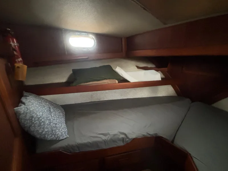 Slide: The Image of 1983 Albin Double Cabin interior with cozy bed and wooden finish. - 39