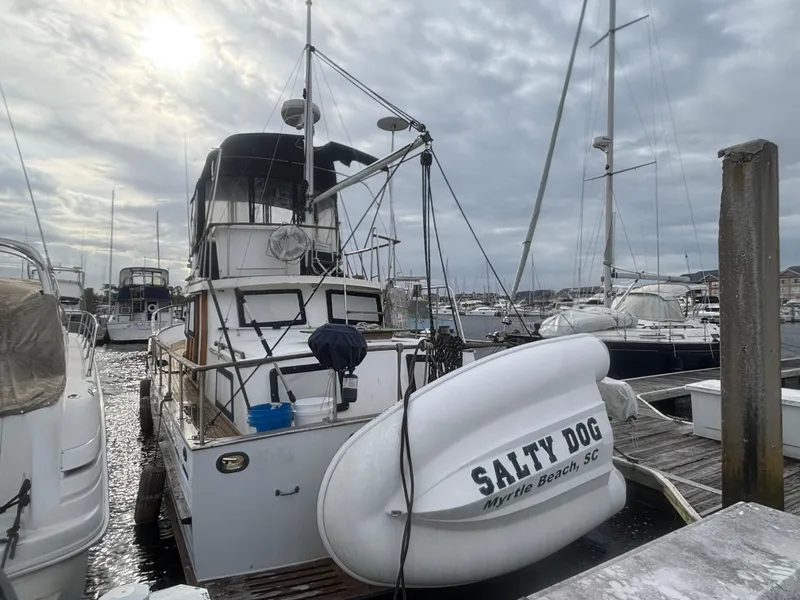 Slide: The Image of 1983 Albin Double Cabin boat docked with dinghy, "Salty Dog," Myrtle Beach, SC. - 4