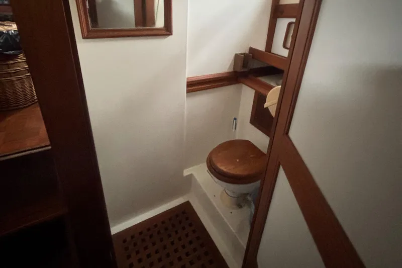 Slide: The Image of 1983 Albin Double Cabin boat bathroom with wooden accents and compact design. - 43