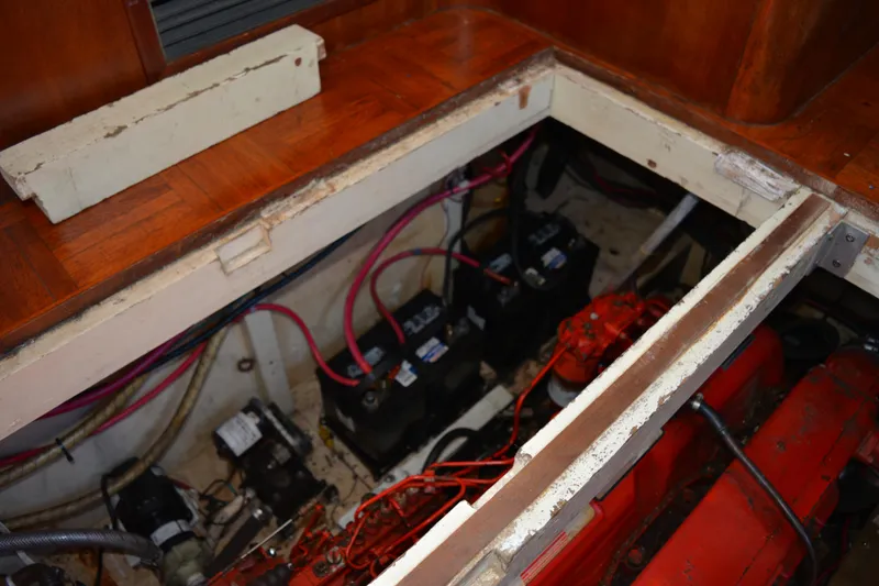 Slide: The Image of 1983 Albin Double Cabin engine compartment with visible wiring and components. - 48