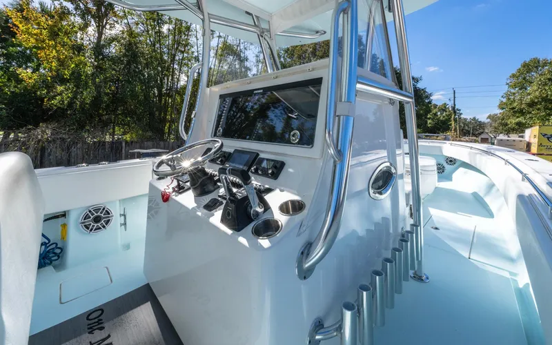 Slide: The Image of 2021 Contender 39 ST boat cockpit with modern controls and sleek design. - 13
