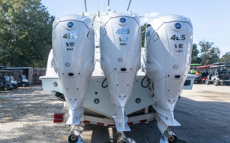 Slide: The Image of 2021 Contender 39 ST boat with triple Yamaha 425 V8 outboard engines. - 16