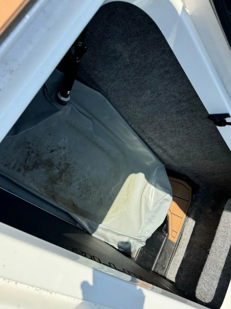 Slide: The Image of 2018 Nautique Super Air Nautique GS24 storage compartment interior. - 22