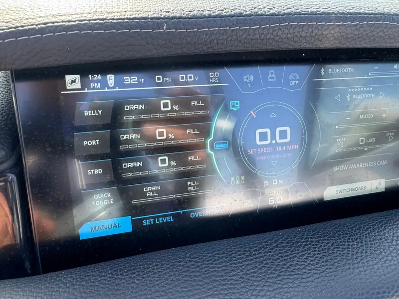 Slide: The Image of Touchscreen display of a 2018 Nautique Super Air Nautique GS24 boat, showing ballast and speed settings. - 28