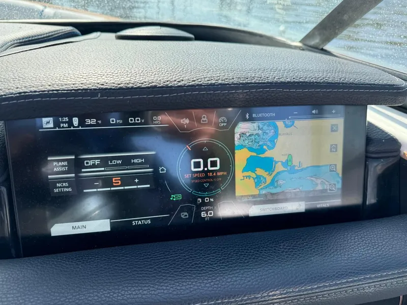 Slide: The Image of Dashboard of 2018 Nautique Super Air Nautique GS24 with navigation and control display. - 35