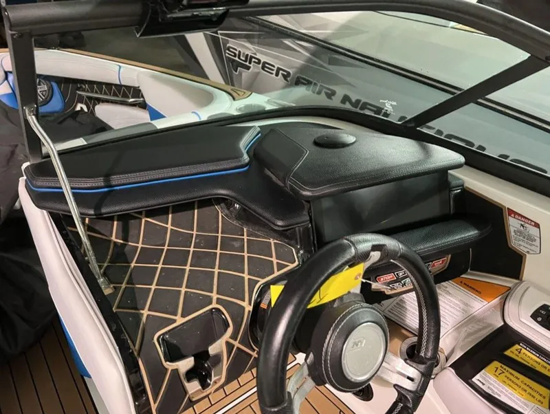 Slide: The Image of 2018 Nautique Super Air Nautique GS24 dashboard and steering wheel interior view. - 4