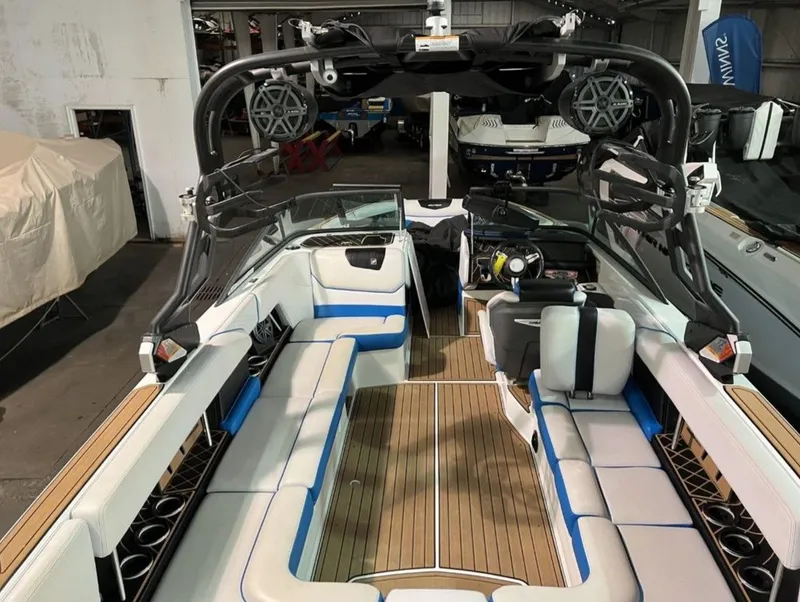 Slide: The Image of 2018 Nautique Super Air Nautique GS24 interior with spacious seating and modern design. - 5