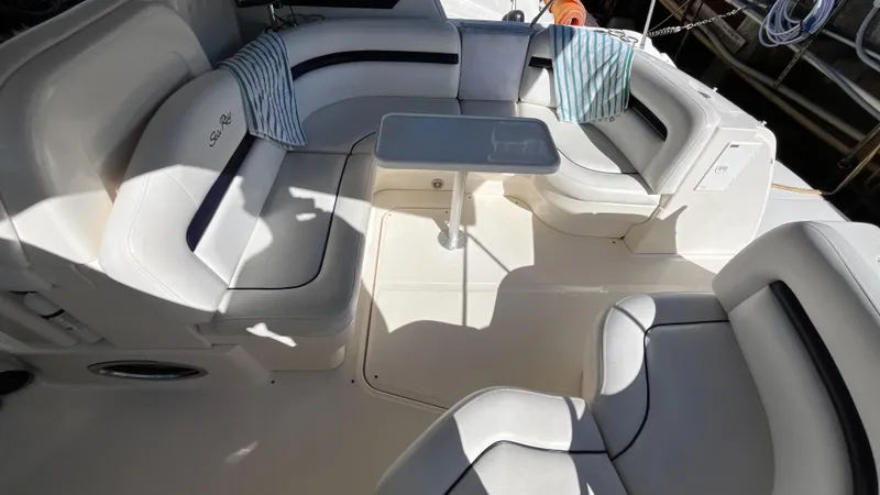 Slide: The Image of Luxurious seating area on a 2008 Sea Ray 380 Sundancer yacht with cushions and table. - 10