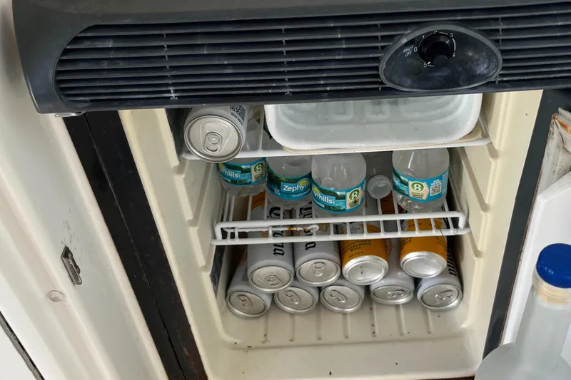 Slide: The Image of Mini fridge stocked with drinks on a 2008 Sea Ray 380 Sundancer boat. - 19