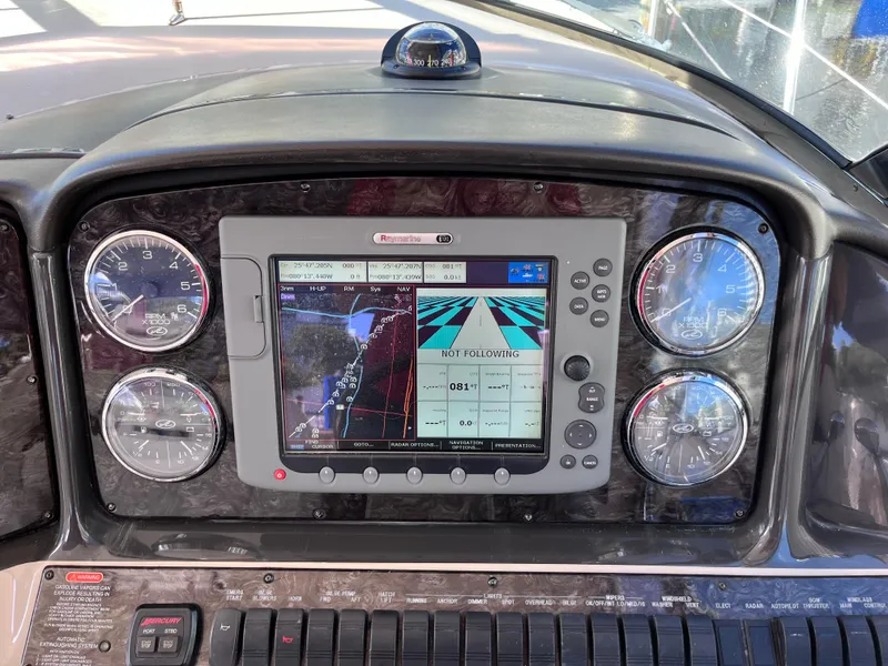 Slide: The Image of Dashboard of 2008 Sea Ray 380 Sundancer with navigation system and gauges. - 25