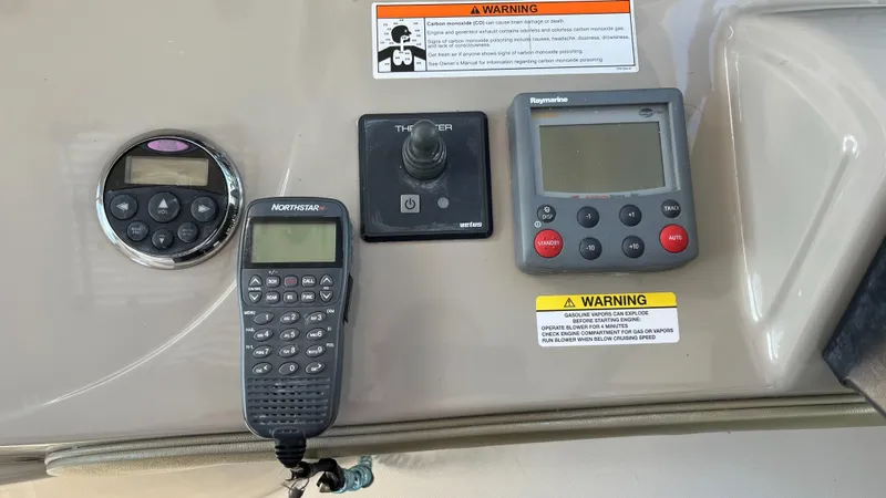 Slide: The Image of Control panel of a 2008 Sea Ray 380 Sundancer with navigation and communication devices. - 27