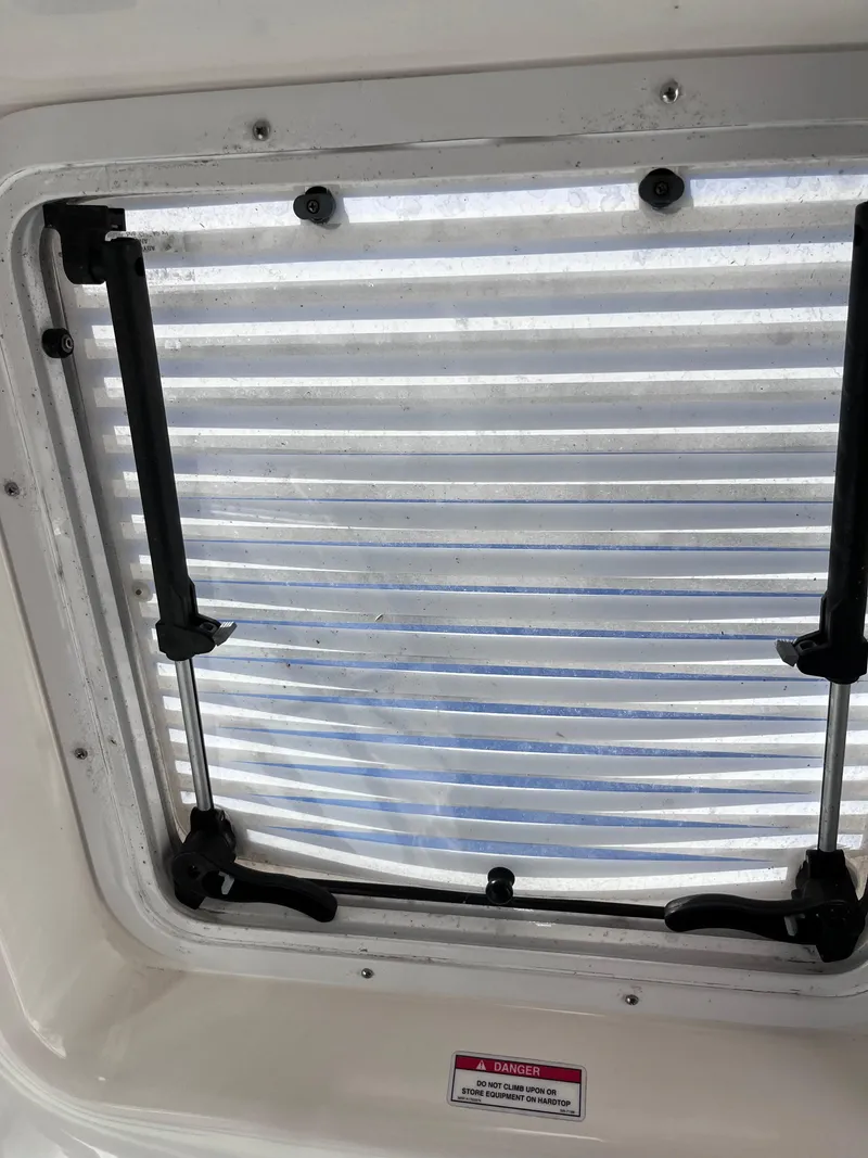 Slide: The Image of Hatch window of 2008 Sea Ray 380 Sundancer with adjustable support arms. - 32
