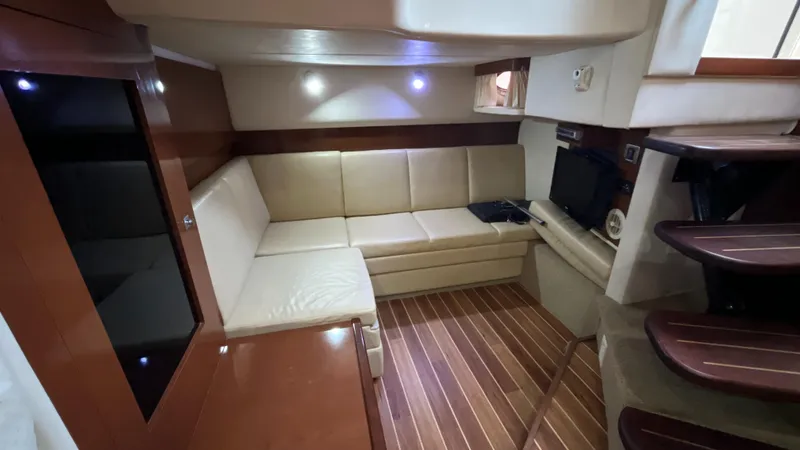 Slide: The Image of Luxurious interior of 2008 Sea Ray 380 Sundancer with leather seating and wooden flooring. - 40