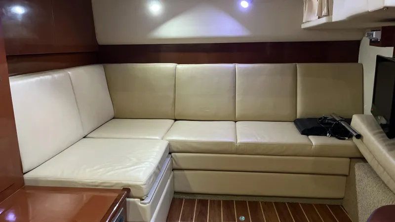 Slide: The Image of Luxurious interior of 2008 Sea Ray 380 Sundancer with beige leather seating. - 41