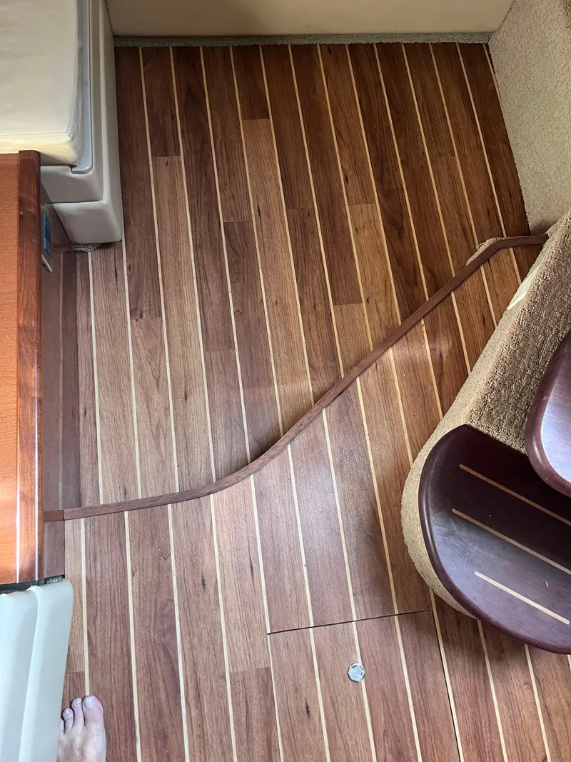 Slide: The Image of Wooden interior flooring of a 2008 Sea Ray 380 Sundancer boat. - 43