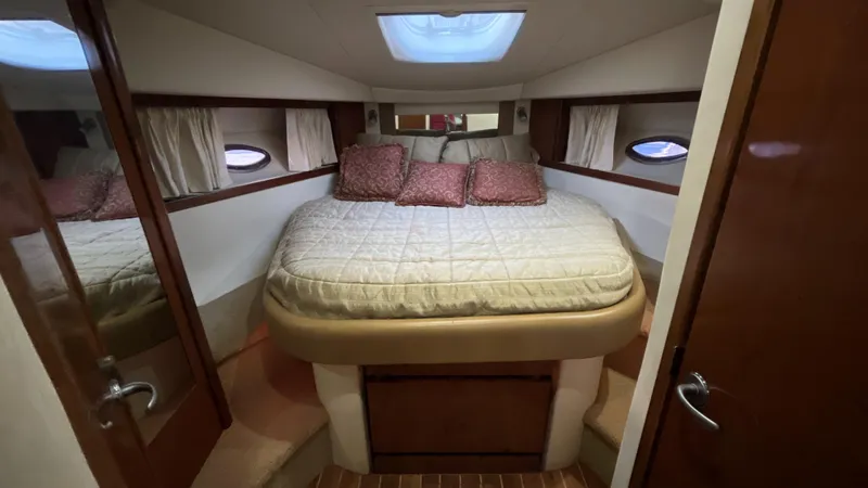 Slide: The Image of 2008 Sea Ray 380 Sundancer cabin with cozy bed and skylight. - 44