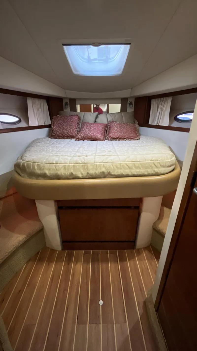 Slide: The Image of Luxurious cabin interior of 2008 Sea Ray 380 Sundancer with cozy bed and skylight. - 45