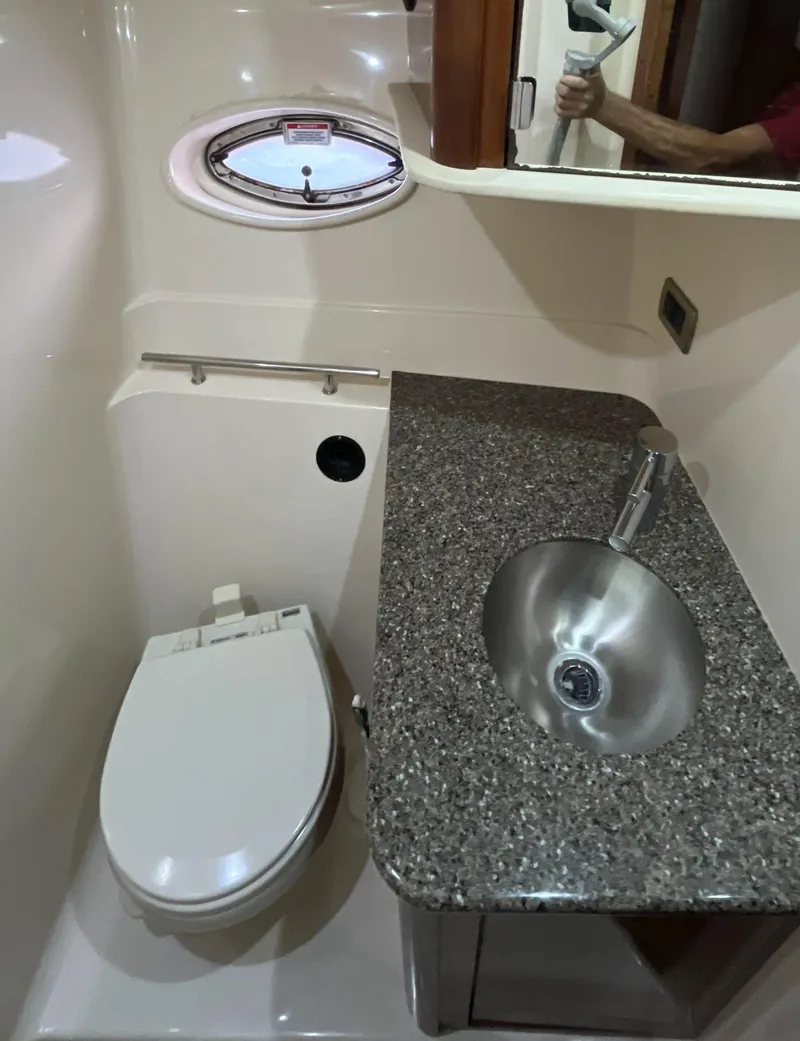 Slide: The Image of 2008 Sea Ray 380 Sundancer bathroom with granite countertop and stainless steel sink. - 46
