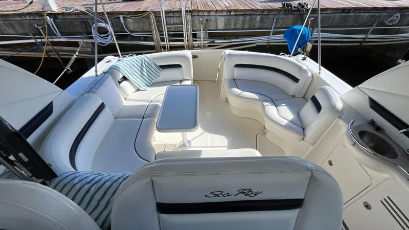 Slide: The Image of 2008 Sea Ray 380 Sundancer boat interior with white seating and table. - 8