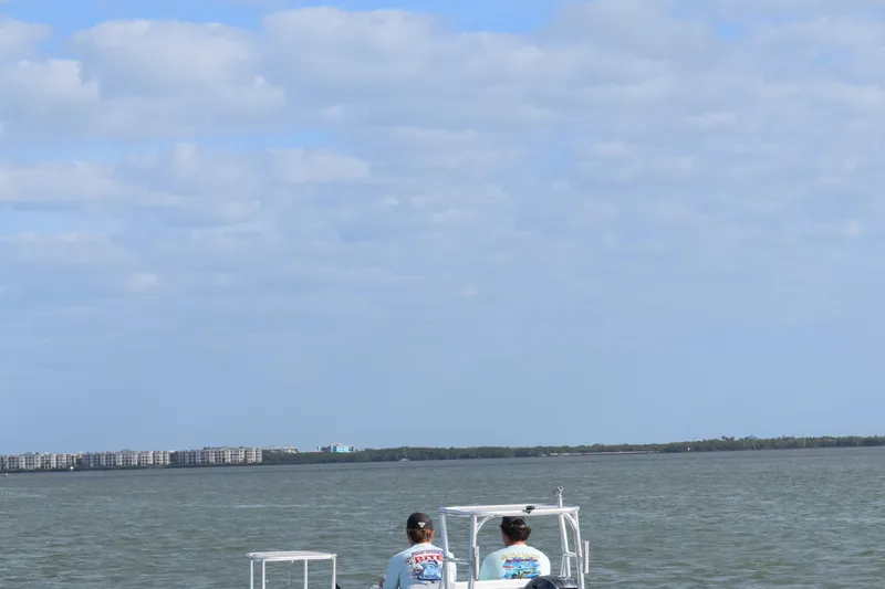 The Image of Cayo Boatworks 180 MV 2025 on calm waters under a cloudy sky. - 4