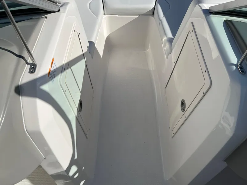Slide: The Image of 2017 Chaparral 19 H2O Sport boat interior with storage compartments. - 13