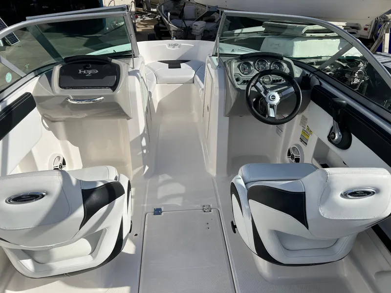 Slide: The Image of 2017 Chaparral 19 H2O Sport boat interior with sleek seating and modern dashboard. - 15