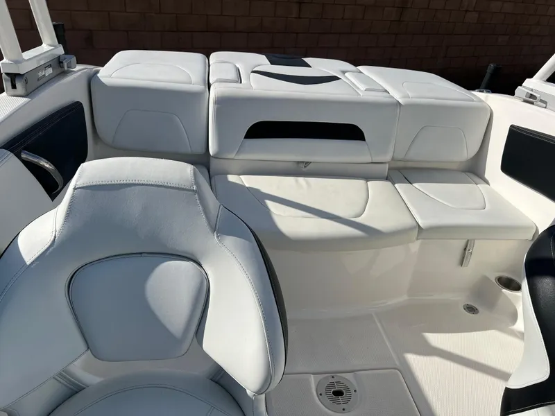 Slide: The Image of 2017 Chaparral 19 H2O Sport boat interior with white seating and sleek design. - 18