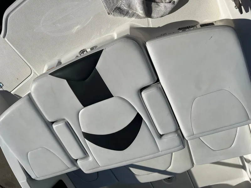 Slide: The Image of 2017 Chaparral 19 H2O Sport boat seating, white and black upholstery. - 20