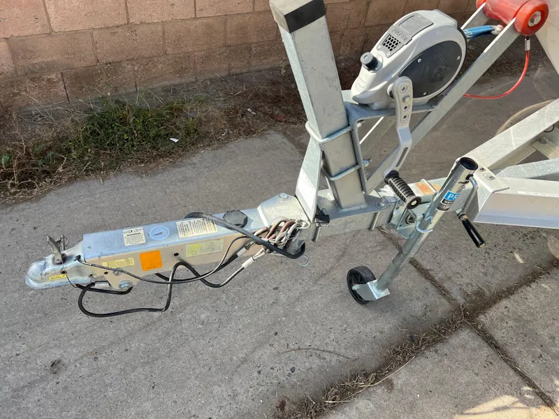 Slide: The Image of Trailer hitch of a 2017 Chaparral 19 H2O Sport on concrete pavement. - 24