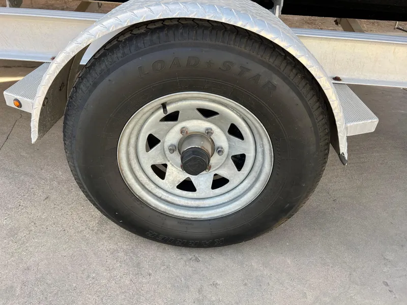 Slide: The Image of Trailer wheel of 2017 Chaparral 19 H2O Sport boat. - 26