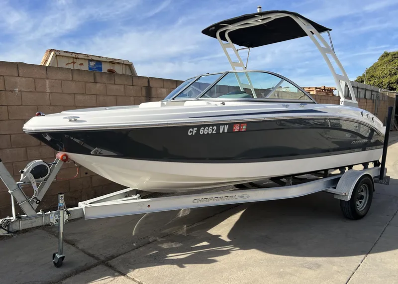 Slide: The Image of 2017 Chaparral 19 H2O Sport boat on trailer, parked outdoors. - 5