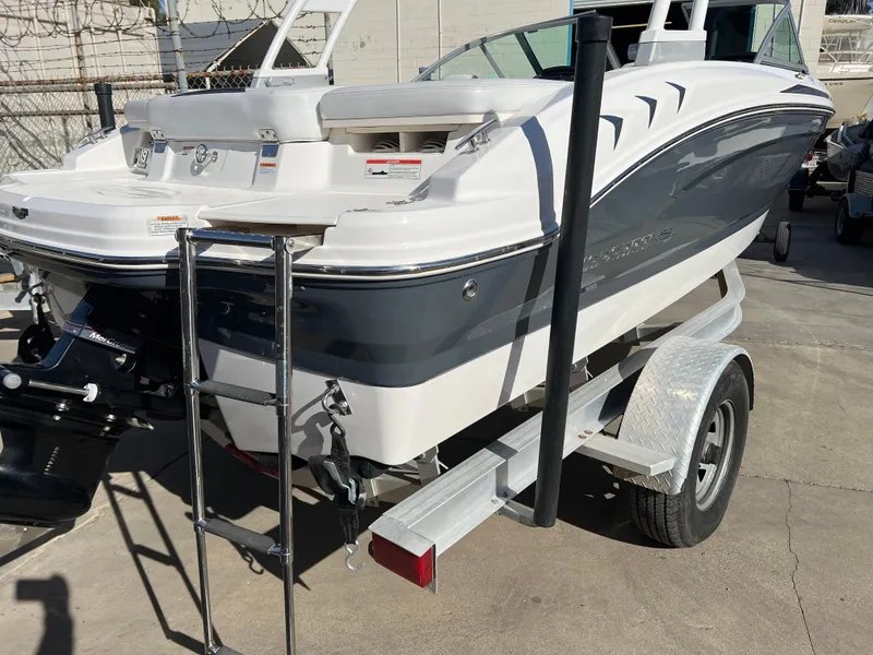Slide: The Image of 2017 Chaparral 19 H2O Sport boat on trailer, rear view. - 7