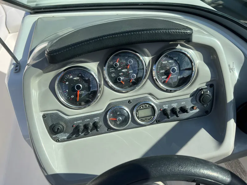 Slide: The Image of Dashboard of 2017 Chaparral 19 H2O Sport boat with gauges and controls. - 9